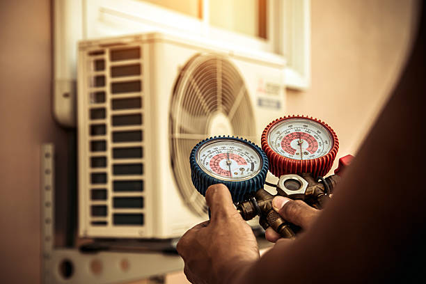 Professional Air Conditioning Service technician working in Clarksville, MD